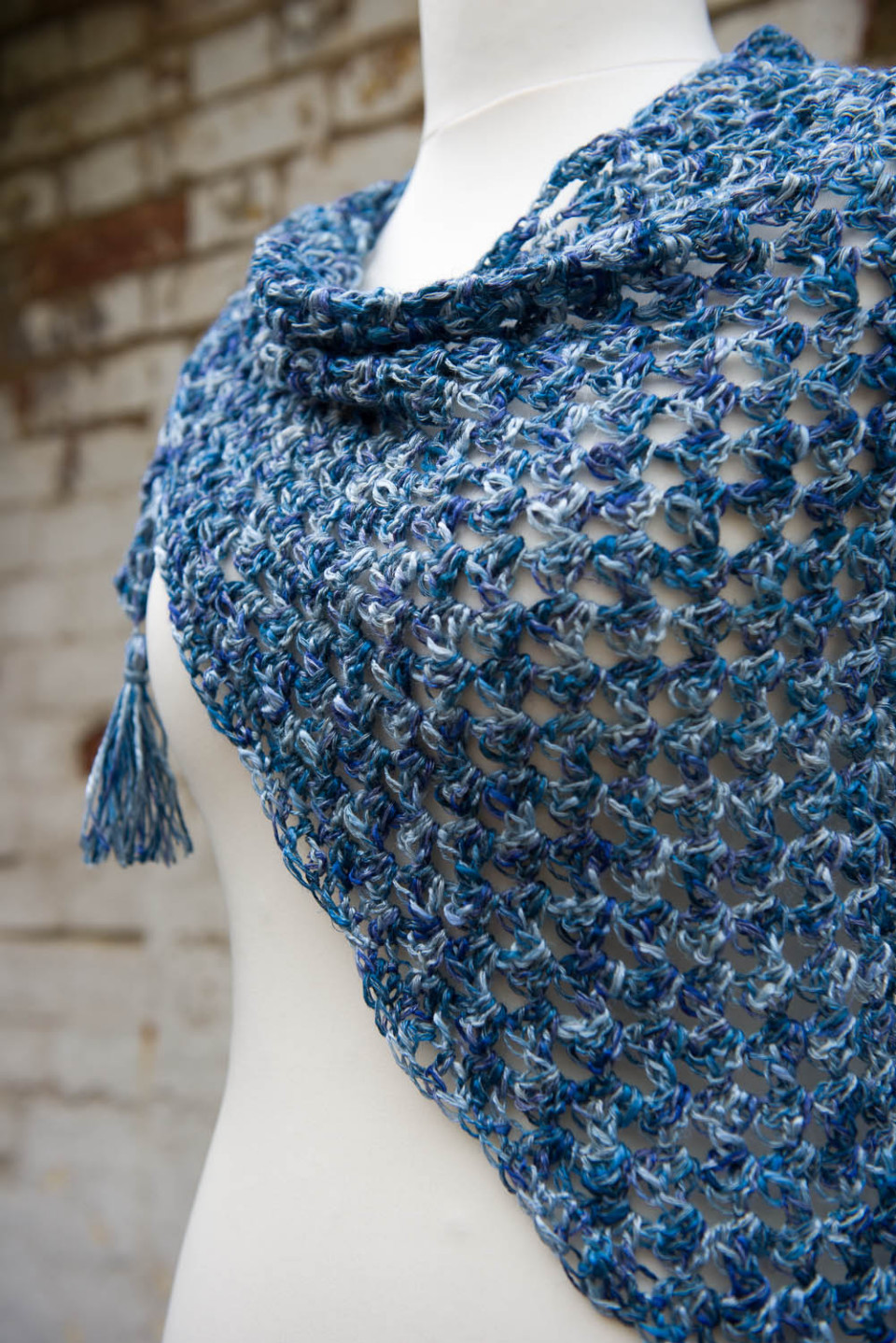 Triangular tassled scarf