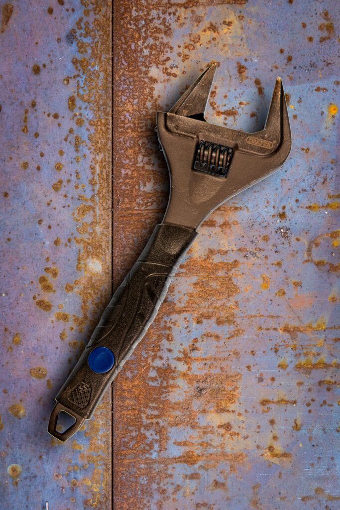 Spanner on a rusty background